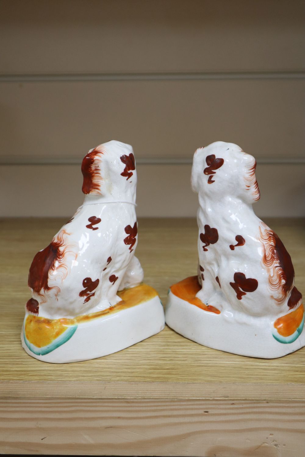 A pair of Staffordshire Spaniels, height 16cm